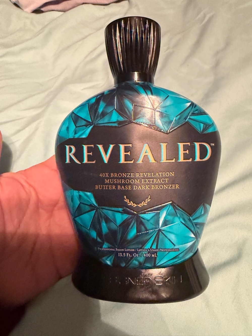 Revealed 40X Bronze Revelation Dark Bronzer – Teal Bottle